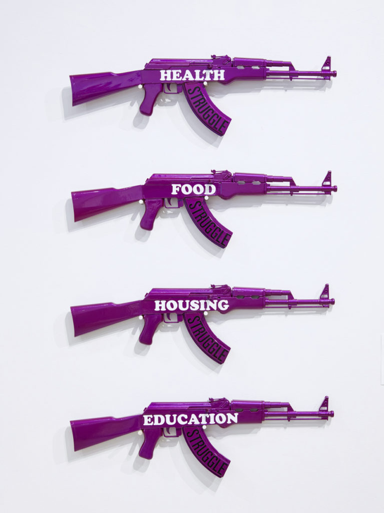 Health, Food, Housing, Education (after the Young Lords), 2015. Wood, urethane enamel, vinyl 72" x 34" x 3.” Courtesy the artist. 