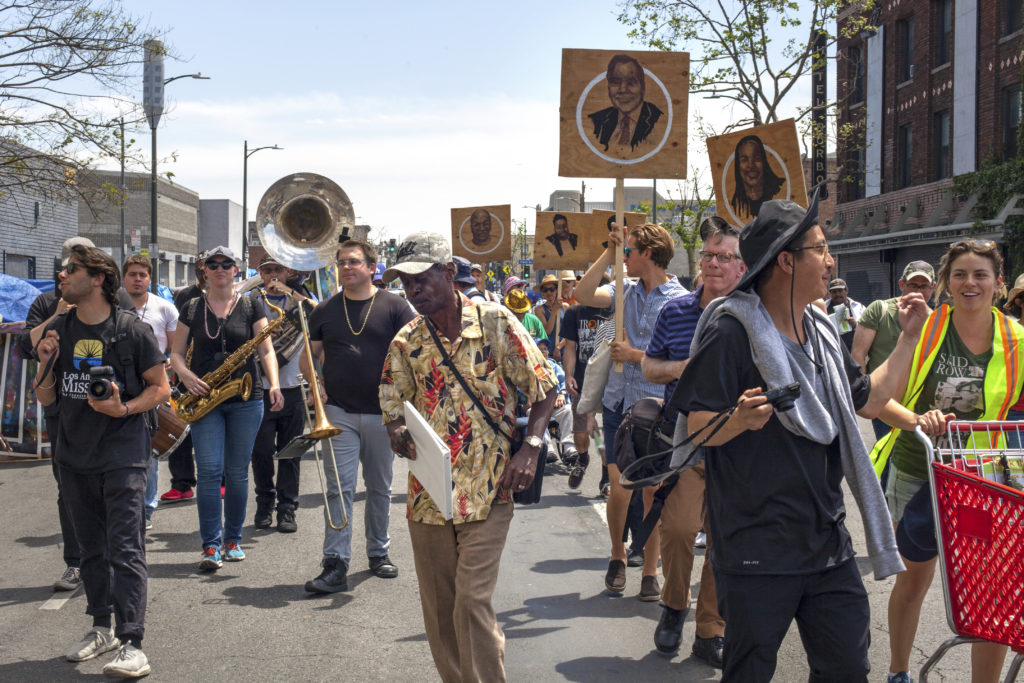 Walk the Talk parade in Skid Row, 2018. Photo by Monica Nouwens © Los Angeles Poverty Department.