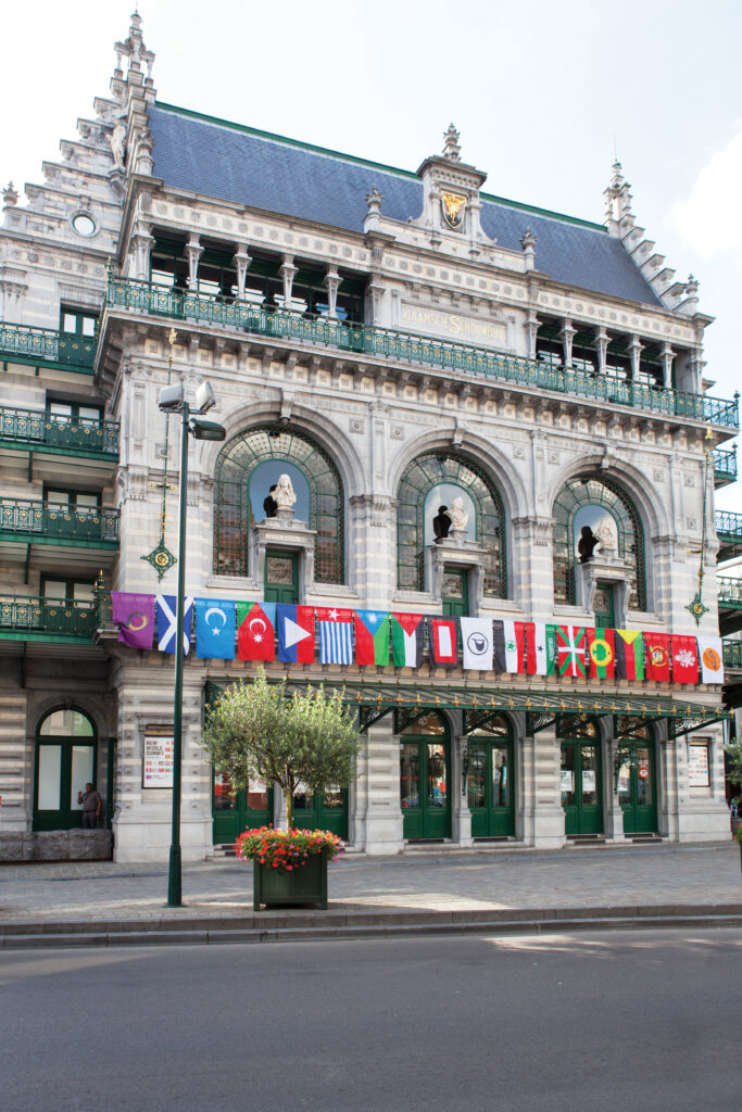 Flags of unrecognized people and states hang on the front of the KVS Royal Flemish theater in Brussels where the New World Summit – Brussels took place in 2014.